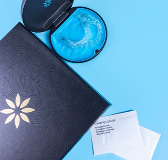 Bird’s eye view of Invisalign and package of cleaning crystals