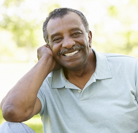 Man smiling outside with All-on-4 dental implants in Mt. Pleasant