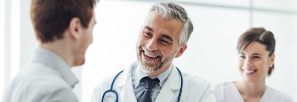 Dentist talking to dental patient