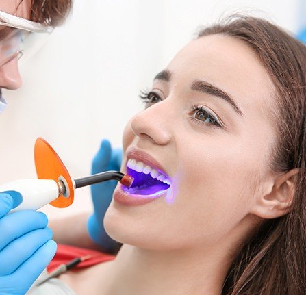 Woman receiving cosmetic dental bonding treatment