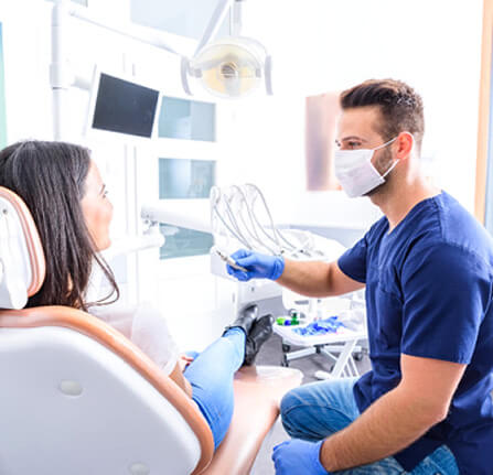 a patient consulting with her dentist about cosmetic dental bonding