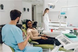 a dentist consulting with a patient