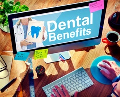 a person looking up their dental benefits online