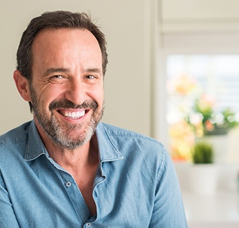 man smiling while inside home