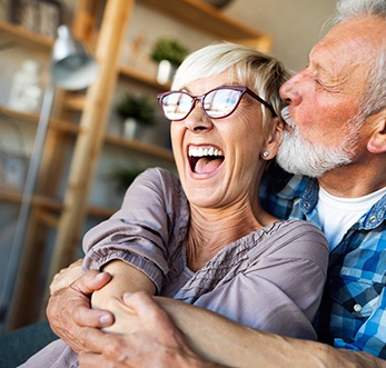 older couple holding each other 