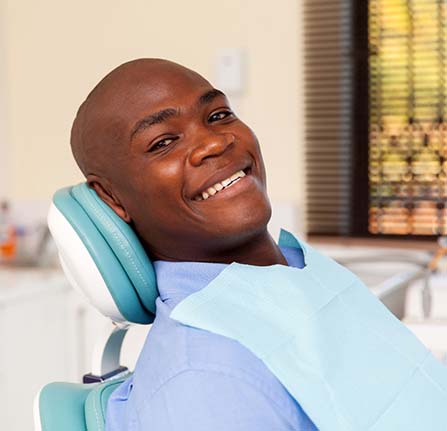 Man smiles after getting toothache treatment in Mt. Pleasant