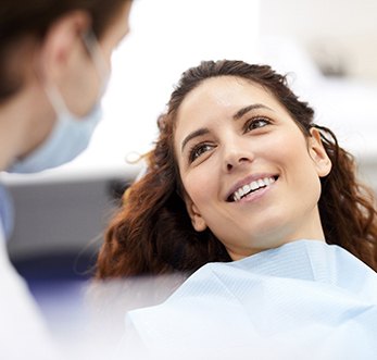 Woman smiling during dental implant consultation in Mt. Pleasant