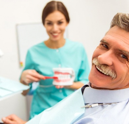 Man smiles after getting dental implants in Mt. Pleasant