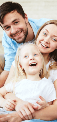 Smiling mother father and child after family dentistry visit