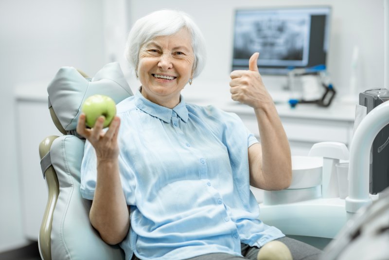 woman with dental implants smiling