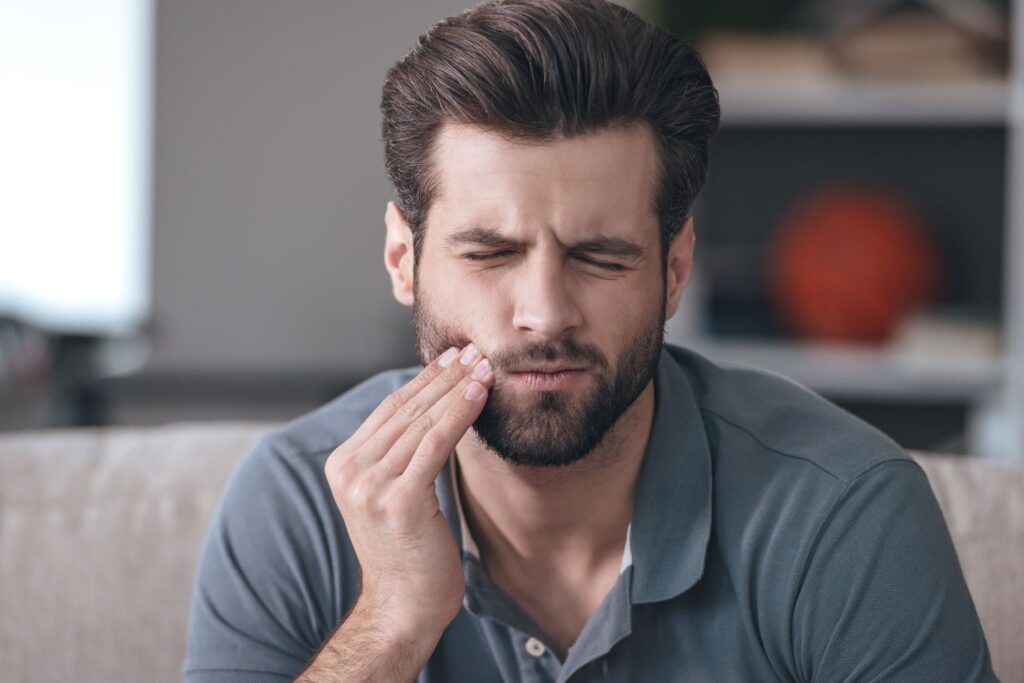 A man with a sensitive tooth